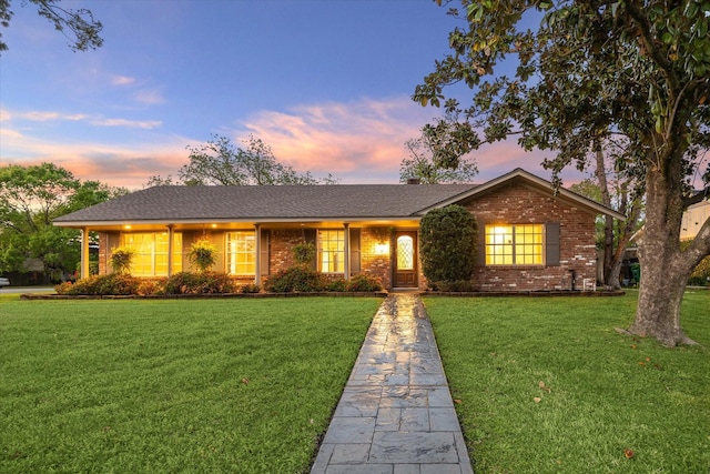 9222 Bronco Dr, Houston, TX 77055 - ranch-style house featuring a yard, brick siding, and roof with shingles
