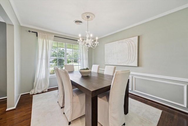 9222 Bronco Dr, Houston, TX 77055 - dining area with a chandelier, wood finished floors, and ornamental molding