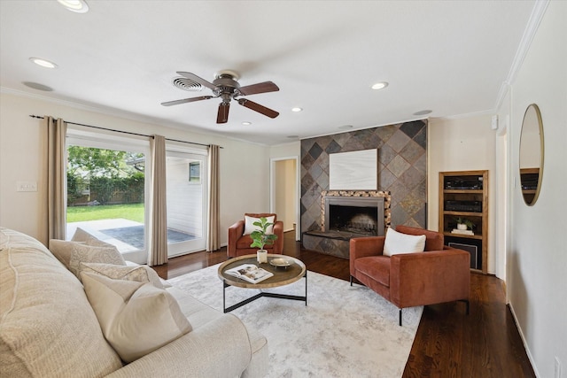 9222 Bronco Dr, Houston, TX 77055 - living area with crown molding, wood finished floors, a ceiling fan, recessed lighting, and a fireplace