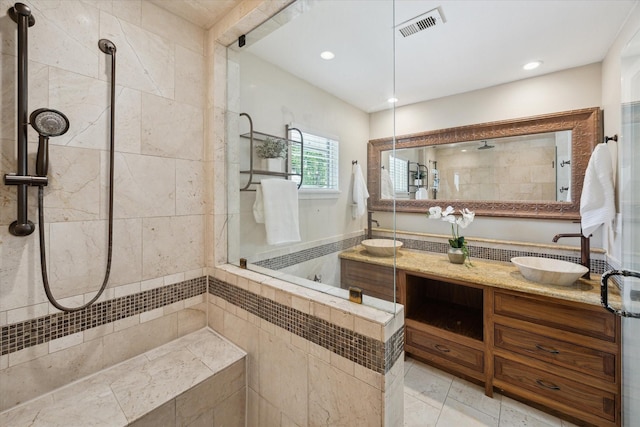 9222 Bronco Dr, Houston, TX 77055 - bathroom featuring a tile shower, double vanity, and recessed lighting