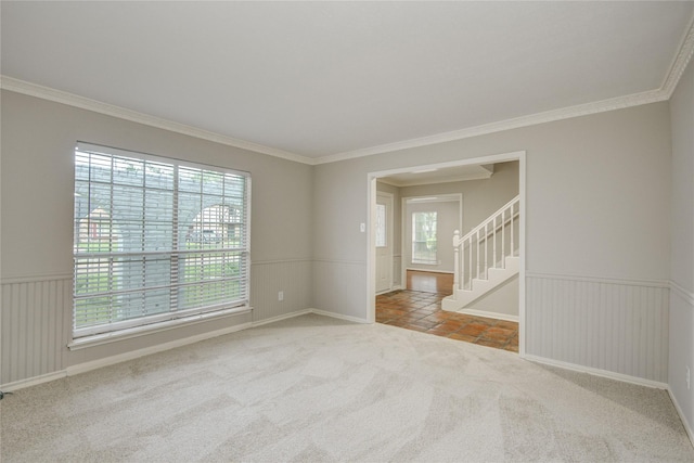 5330 Boyce Springs Dr, Houston, TX 77066 - spare room with healthy amount of natural light, carpet flooring, ornamental molding, wainscoting, and stairs