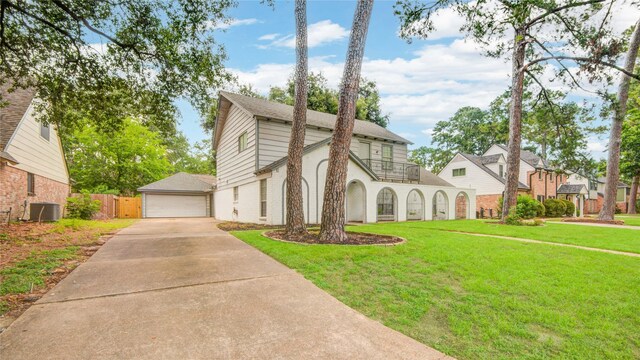 5330 Boyce Springs Dr, Houston, TX 77066 - traditional home featuring a balcony, brick siding, and a detached garage