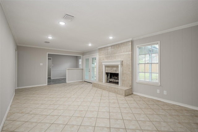 5330 Boyce Springs Dr, Houston, TX 77066 - unfurnished living room with crown molding, a tile fireplace, recessed lighting, and light tile patterned floors