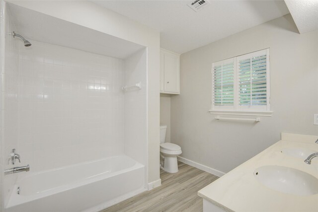 5330 Boyce Springs Dr, Houston, TX 77066 - bathroom with wood finished floors, washtub / shower combination, and double vanity