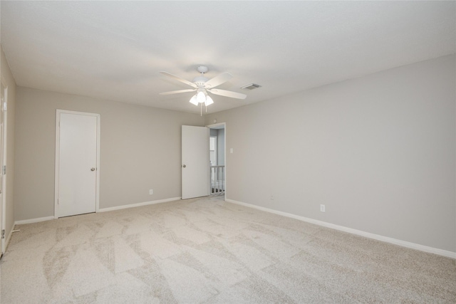 5330 Boyce Springs Dr, Houston, TX 77066 - unfurnished bedroom featuring light carpet and a ceiling fan
