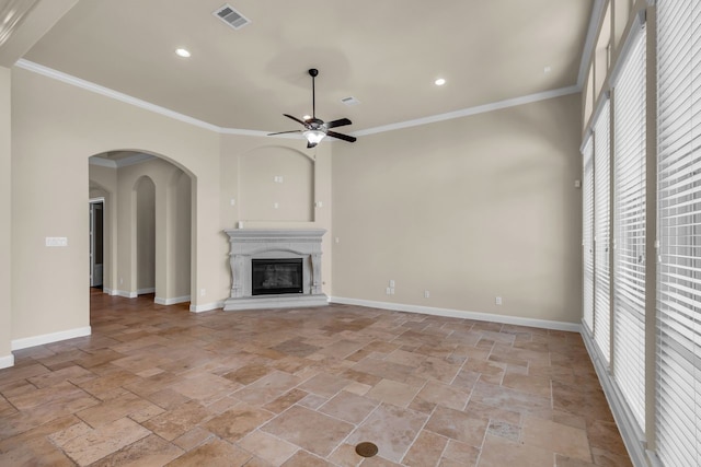 20307 Knights Branch Dr, Cypress, TX 77433 - unfurnished living room featuring stone tile floors, a ceiling fan, plenty of natural light, crown molding, and recessed lighting