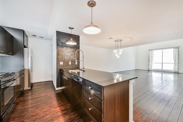3028 Commerce St, Houston, TX 77003 - kitchen featuring stainless steel range, dark wood-style floors, freestanding refrigerator, and black dishwasher