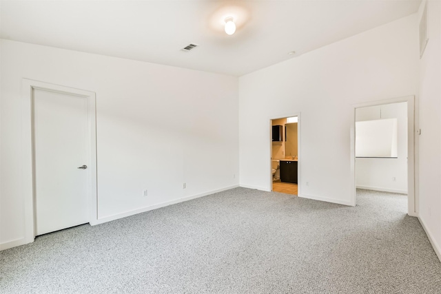 3028 Commerce St, Houston, TX 77003 - spare room featuring carpet flooring and baseboards