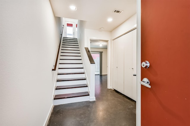 3028 Commerce St, Houston, TX 77003 - entryway featuring finished concrete floors, stairs, and recessed lighting