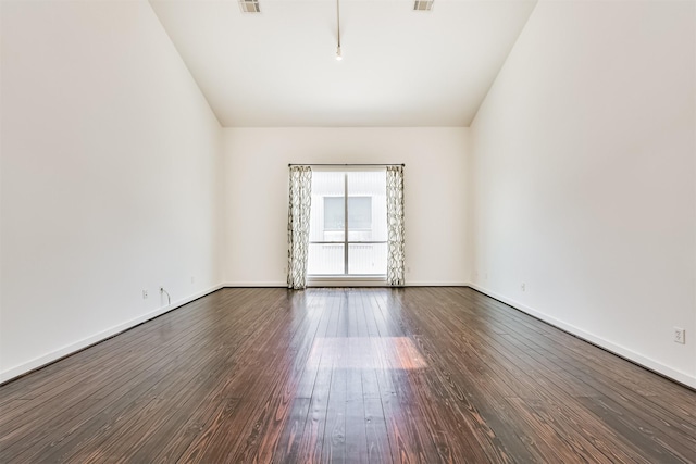 3028 Commerce St, Houston, TX 77003 - spare room with dark wood finished floors and vaulted ceiling