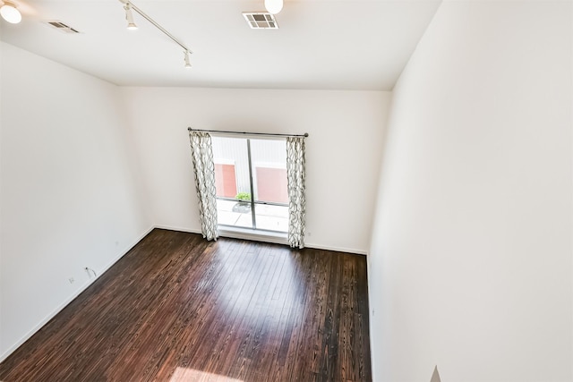 3028 Commerce St, Houston, TX 77003 - empty room with wood finished floors and rail lighting