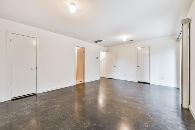 3028 Commerce St, Houston, TX 77003 - empty room featuring concrete floors and baseboards
