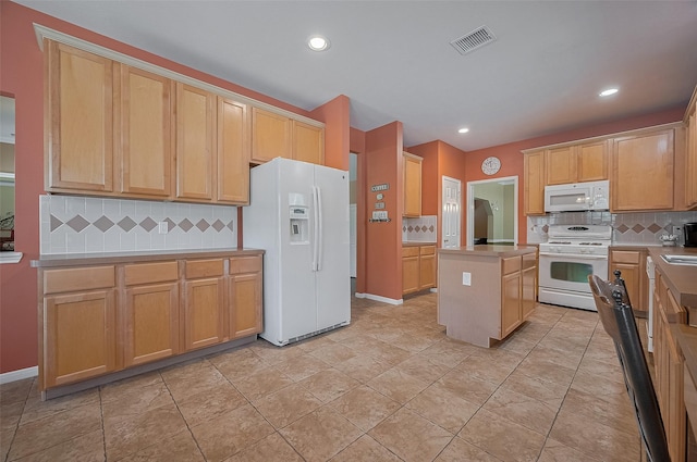 24922 Falcon Hollow Ln, Katy, TX 77494 - kitchen with white appliances, tasteful backsplash, light countertops, recessed lighting, and a center island