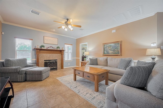24922 Falcon Hollow Ln, Katy, TX 77494 - living room with a ceiling fan, crown molding, and a glass covered fireplace