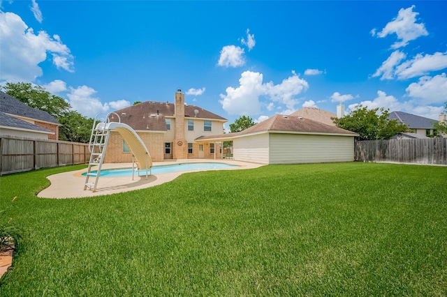 24922 Falcon Hollow Ln, Katy, TX 77494 - rear view of house featuring a fenced backyard, a patio, and a chimney
