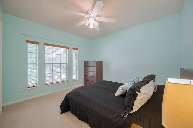 24922 Falcon Hollow Ln, Katy, TX 77494 - carpeted bedroom featuring baseboards and a ceiling fan