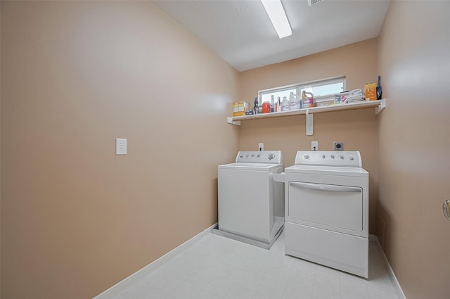 24922 Falcon Hollow Ln, Katy, TX 77494 - washroom with washing machine and dryer and baseboards