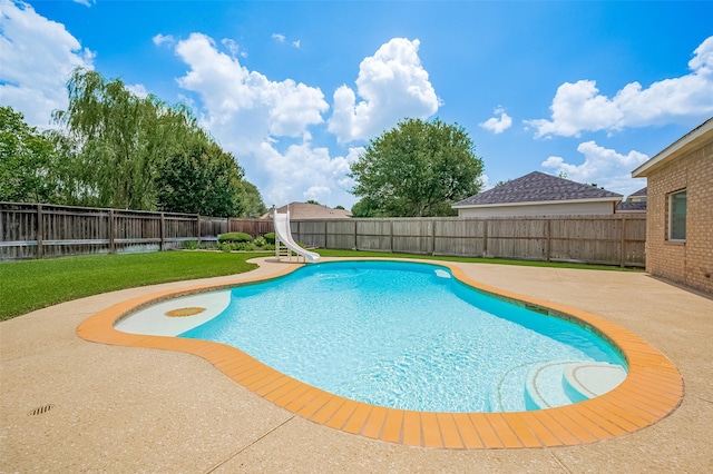 24922 Falcon Hollow Ln, Katy, TX 77494 - view of swimming pool with a water slide, a patio area, and a fenced backyard