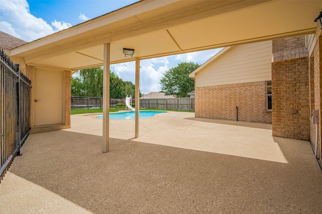 24922 Falcon Hollow Ln, Katy, TX 77494 - view of swimming pool featuring a patio area, a water slide, and a fenced backyard