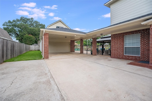 1201 Coryell St, League City, TX 77573 - garage with driveway and an attached carport