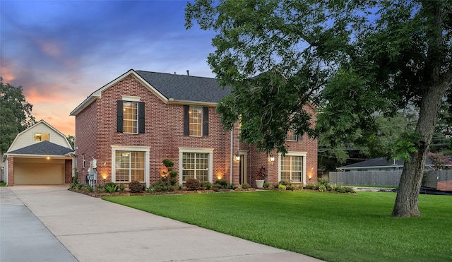1201 Coryell St, League City, TX 77573 - view of front facade featuring concrete driveway, a garage, brick siding, and roof with shingles