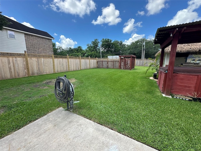 1201 Coryell St, League City, TX 77573 - fenced backyard with a hot tub and a patio area