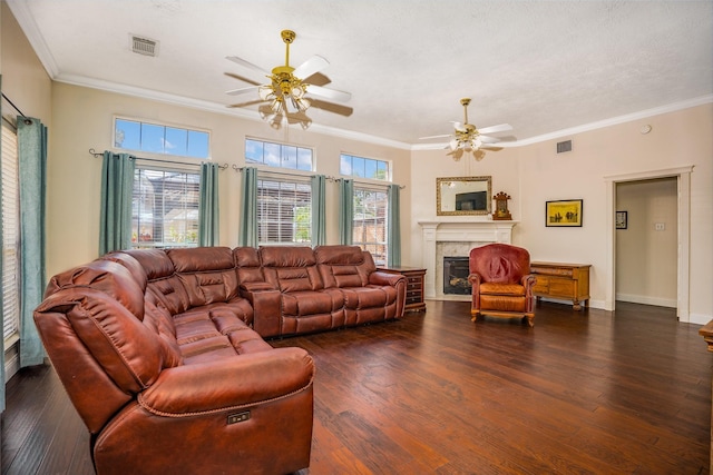 1201 Coryell St, League City, TX 77573 - living room with ceiling fan, a tile fireplace, dark wood-style flooring, and ornamental molding