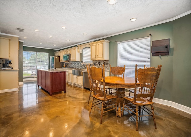 1201 Coryell St, League City, TX 77573 - dining space featuring finished concrete flooring, ornamental molding, recessed lighting, and a textured ceiling
