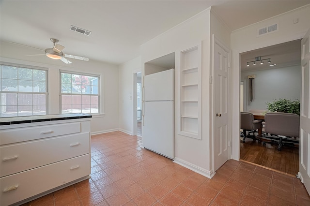 826 Heights Blvd, Houston, TX 77007 - kitchen featuring freestanding refrigerator, a ceiling fan, white cabinetry, and built in features