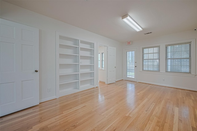 826 Heights Blvd, Houston, TX 77007 - unfurnished room with light wood finished floors and built in shelves