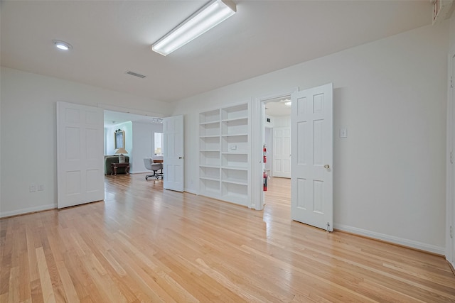 826 Heights Blvd, Houston, TX 77007 - empty room featuring built in features and light wood-style flooring