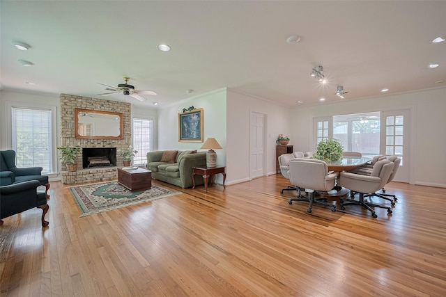826 Heights Blvd, Houston, TX 77007 - living room with ceiling fan, light wood-style floors, crown molding, a large fireplace, and recessed lighting