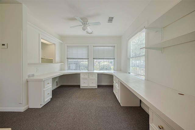 826 Heights Blvd, Houston, TX 77007 - unfurnished office featuring built in study area, ceiling fan, and dark colored carpet