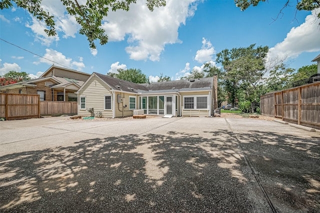 826 Heights Blvd, Houston, TX 77007 - back of house featuring a chimney and a sunroom