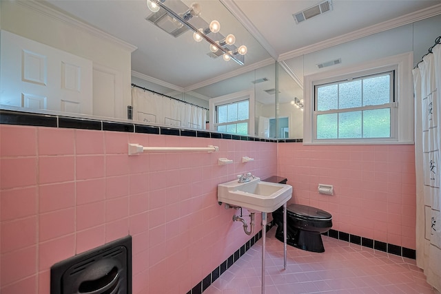 826 Heights Blvd, Houston, TX 77007 - full bathroom featuring tile walls, crown molding, and tile patterned flooring