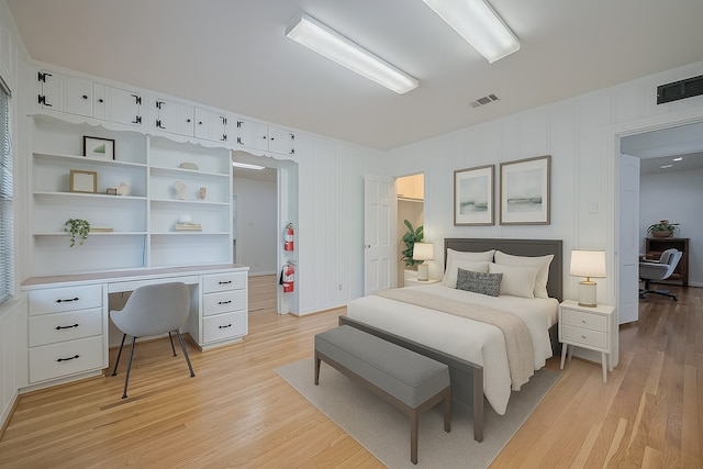 826 Heights Blvd, Houston, TX 77007 - bedroom with light wood-type flooring and built in study area