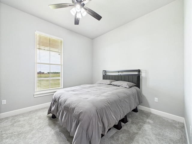 2711 Oakwood Shores Dr, Richwood, TX 77515 - bedroom with carpet flooring, vaulted ceiling, and ceiling fan