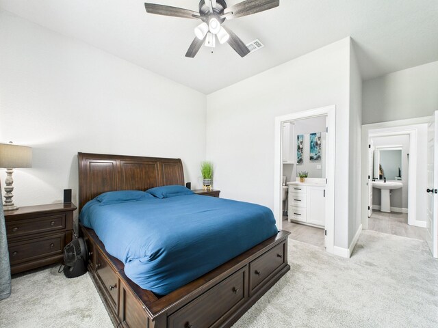 2711 Oakwood Shores Dr, Richwood, TX 77515 - bedroom with light carpet, connected bathroom, and ceiling fan