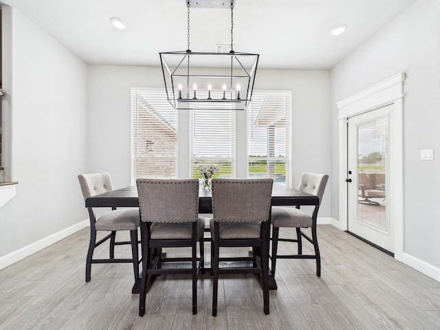 2711 Oakwood Shores Dr, Richwood, TX 77515 - dining space with a chandelier, light wood-style flooring, and recessed lighting