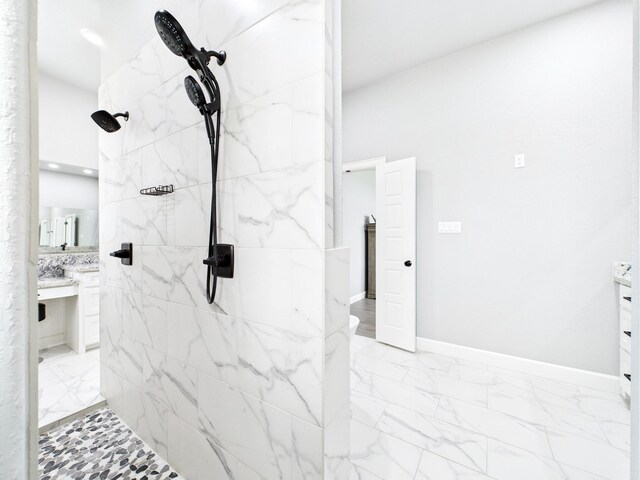 2711 Oakwood Shores Dr, Richwood, TX 77515 - full bathroom featuring marble finish floors, vanity, and a tile shower