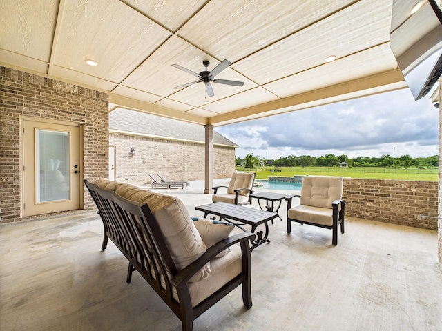 2711 Oakwood Shores Dr, Richwood, TX 77515 - view of patio with ceiling fan, an outdoor pool, and outdoor lounge area