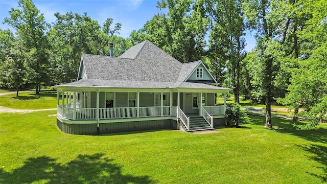 38 Darrell White Rd, Huntsville, TX 77340 - farmhouse featuring a porch, roof with shingles, and a front lawn