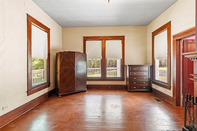 38 Darrell White Rd, Huntsville, TX 77340 - unfurnished bedroom featuring hardwood / wood-style flooring and baseboards