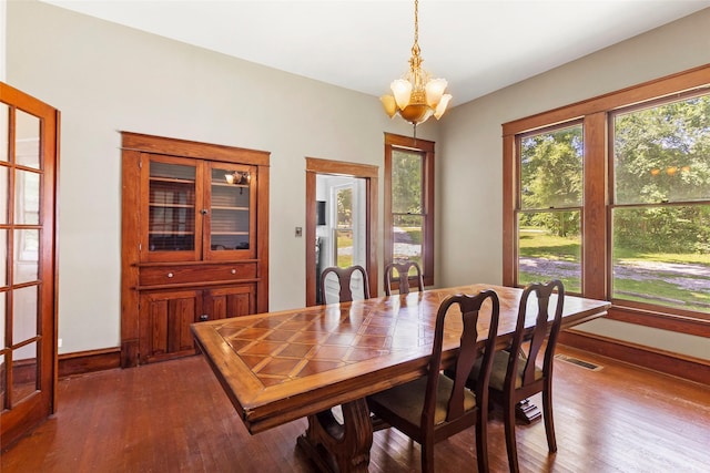 38 Darrell White Rd, Huntsville, TX 77340 - dining space with a chandelier and dark wood-type flooring