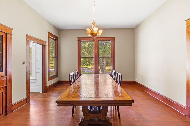 38 Darrell White Rd, Huntsville, TX 77340 - dining area featuring wood finished floors and a chandelier