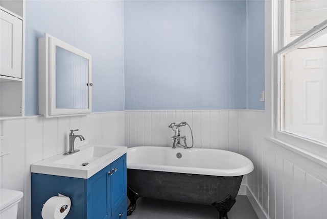 38 Darrell White Rd, Huntsville, TX 77340 - bathroom with a freestanding tub, wainscoting, and vanity