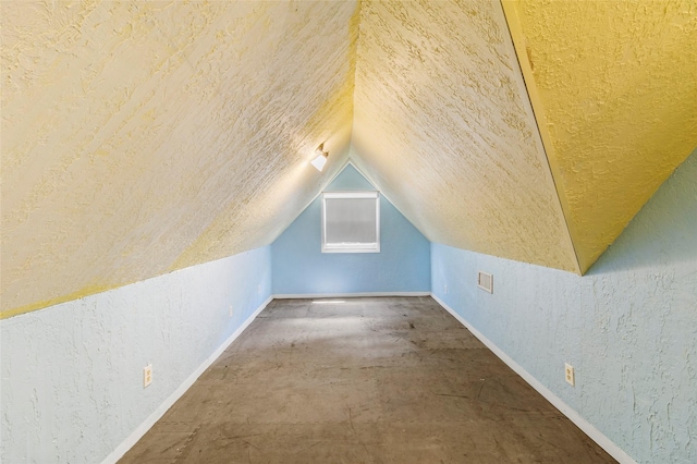 38 Darrell White Rd, Huntsville, TX 77340 - bonus room with a textured wall, vaulted ceiling, and a textured ceiling