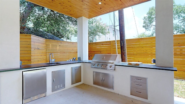 5055 Yarwell Dr, Houston, TX 77096 - view of patio featuring a sink and exterior kitchen