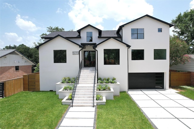 5055 Yarwell Dr, Houston, TX 77096 - view of front of property featuring stucco siding, an attached garage, driveway, and stairway