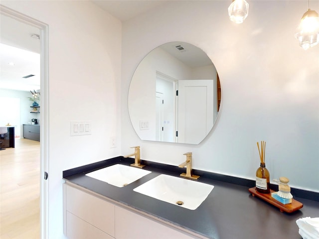 5055 Yarwell Dr, Houston, TX 77096 - bathroom with double vanity and wood finished floors